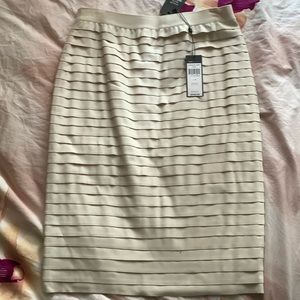BCBGMaxazria off white skirt tagged as women’s size M